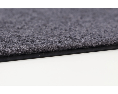 Gros plan d''un tapis de sol gris avec surface textile et bordure en caoutchouc