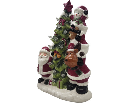 Décoration de Noël avec le Père Noël, un bonhomme de neige, un ours en peluche et un renne à côté d''un sapin de Noël