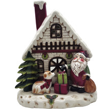 Scène de Noël décorative avec maison, Père Noël, chien et cadeaux