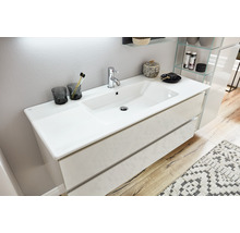 Meuble sous-lavabo avec lavabo à poser et deux tiroirs dans la salle de bains.