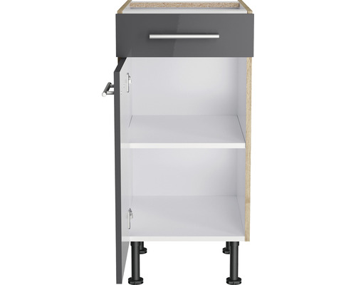 Meuble bas avec tiroir, porte ouverte et étagères