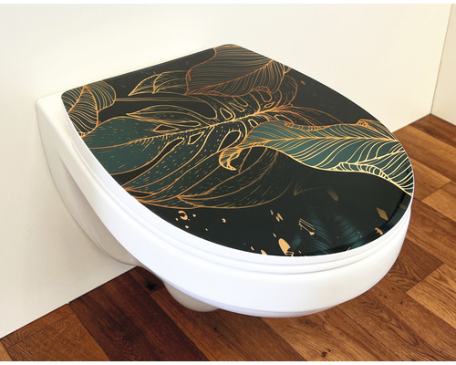 Toilettes avec film décoratif à motif de feuilles