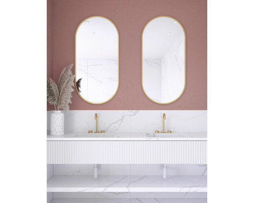 Salle de bains avec deux miroirs ovales, meuble sous-lavabo et décoration