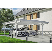 Double carport en bois avec deux voitures dans une cour pavée