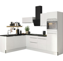 Cuisine moderne avec armoires blanches, plan de travail noir et hotte aspirante.