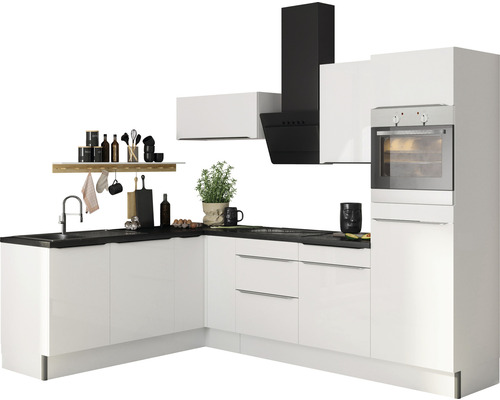 Cuisine moderne avec armoires blanches, plan de travail noir et hotte aspirante.