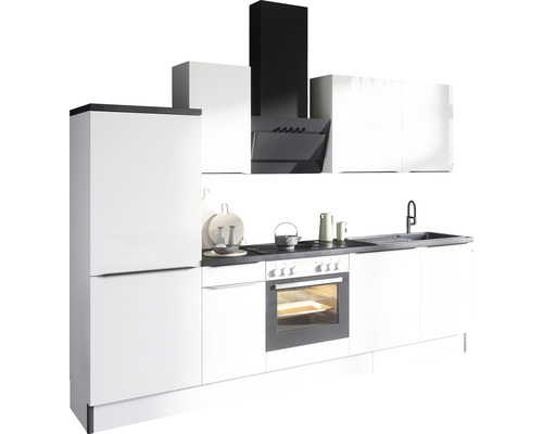 Cuisine moderne avec armoires blanches, plan de travail noir et hotte aspirante.