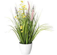 Plante artificielle avec des fleurs jaunes et violettes dans un pot blanc