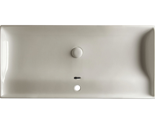 Lavabo en céramique vu de dessus avec trop-plein et évacuation