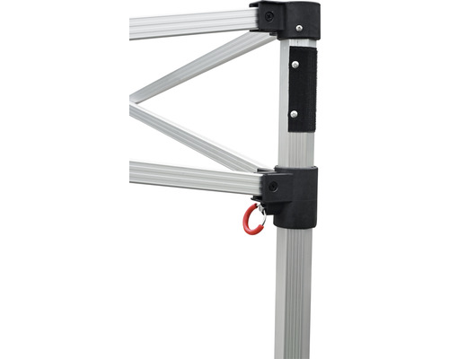 Vue détaillée de l''armature d''une tente pliante avec des supports en aluminium et un anneau rouge