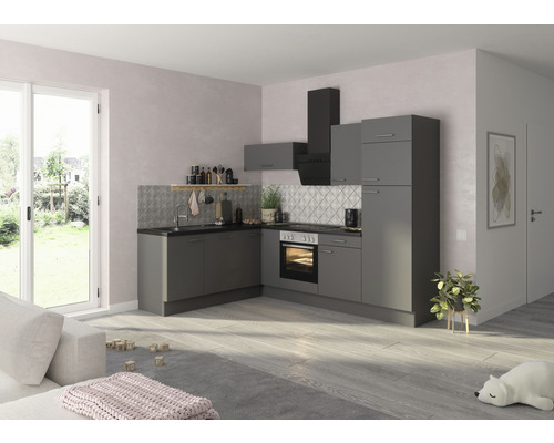 Cuisine intégrée grise avec hotte aspirante dans une pièce moderne