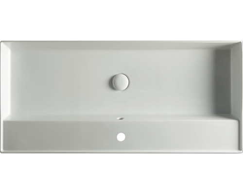 Aufsicht auf ein rechteckiges Waschbecken aus Keramik mit Ablaufstopfen und Hahnloch