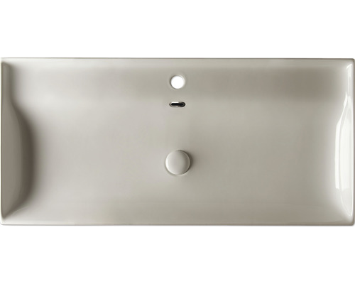 Vue de dessus d''un lavabo avec trop-plein et bonde.