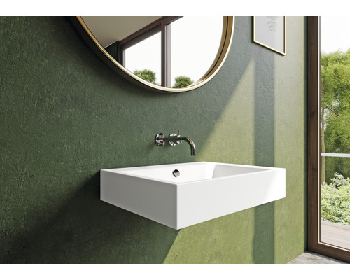 Modernes Badezimmer mit rechteckigem Waschbecken, rundem Spiegel und Armatur