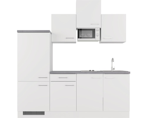Cuisine moderne avec armoires blanches, évier et micro-ondes