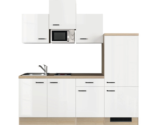 Cuisine équipée avec évier, micro-ondes et éléments hauts pour une solution de cuisine compacte