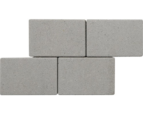 Quatre pavés en béton gris