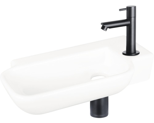 Weisses Aufsatzwaschbecken mit schwarzer Armatur