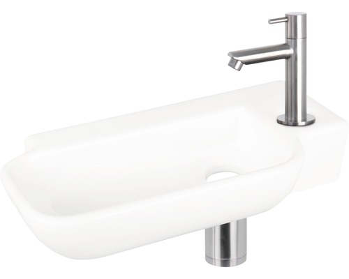 Weisses Keramik-Waschbecken mit Armatur
