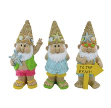 Drei Gartenzwerge mit Strandmotiven