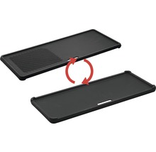 Plaque de cuisson réversible en fonte avec motif de gril et face lisse