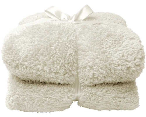 Zusammengelegte, flauschige Decke mit Schleife