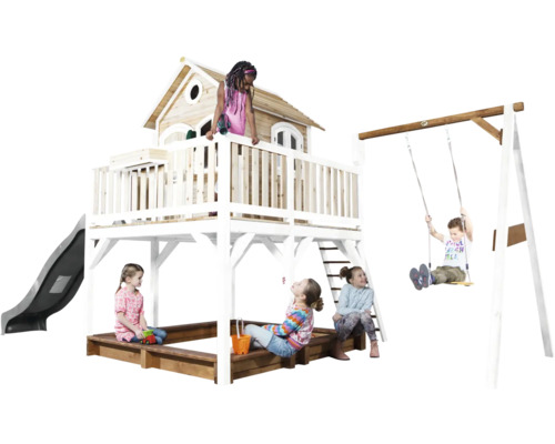 Aire de jeux avec cabane, toboggan, balançoire et bac à sable avec des enfants qui jouent