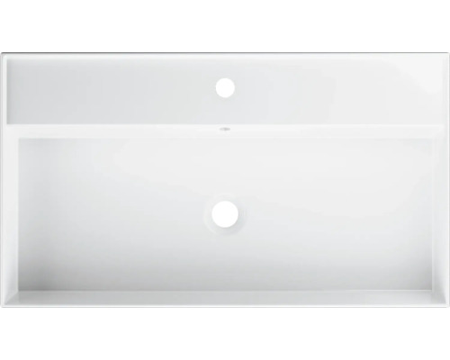 Vue de dessus d''un lavabo blanc avec trou de robinet et trop-plein