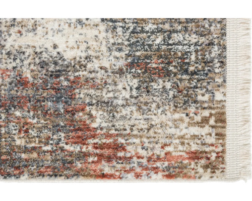 Vue détaillée d''un tapis à motifs avec des franges