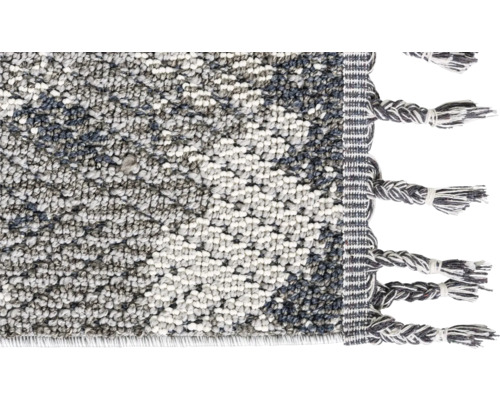 Vue détaillée d''un tapis avec des franges