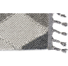 Vue détaillée d''un tapis avec des franges