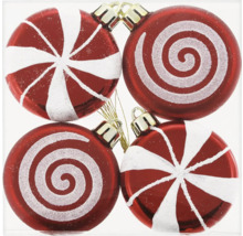 Quatre boules de Noël rouges à motifs blancs