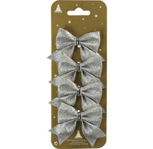 Vier silberne Schleifen als Weihnachtsbaumschmuck in Verpackung