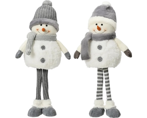 Deux bonhommes de neige en tissu avec bonnets et écharpes comme décorations de Noël