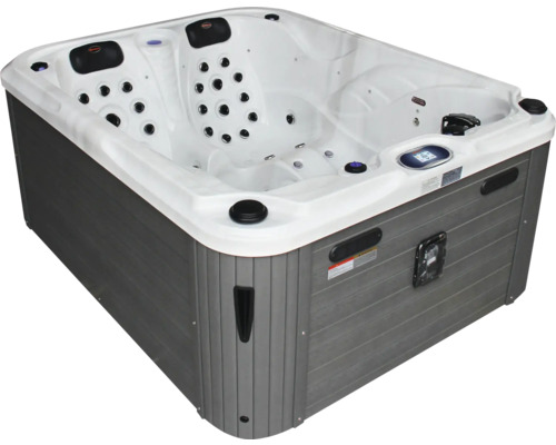 Whirlpool mit grauer Verkleidung und vielen Düsen