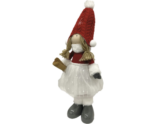 Dekorative Stoffpuppe mit Mütze und Skiern als Winterdekoration