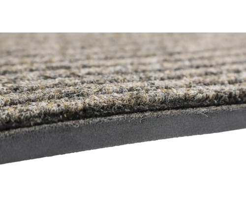 Vue détaillée d''un paillasson avec structure rainurée et dessous en mousse