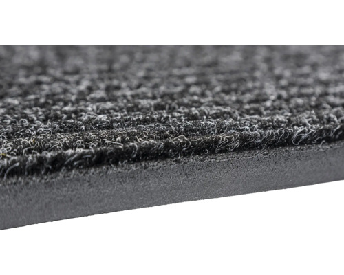 Vue détaillée d''un tapis de propreté avec surface textile et dos en caoutchouc