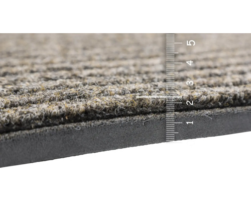 Vue détaillée d''un paillasson avec échelle de mesure pour indiquer l''épaisseur