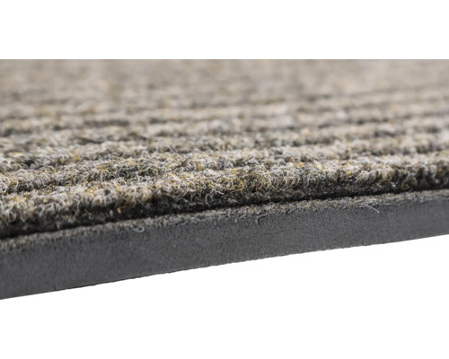 Vue détaillée d''un paillasson avec surface côtelée et dos en caoutchouc