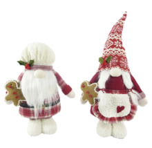 Deux figurines de Noël en forme de lutins tenant du pain d''épices
