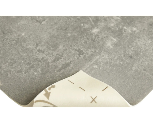 Dalle de sol autocollante aspect pierre avec film de protection amovible.