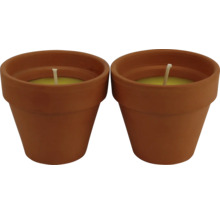 Zwei Kerzen in Terrakotta Blumentöpfen