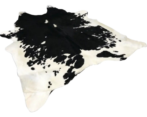 Tapis en peau de vache tacheté noir et blanc