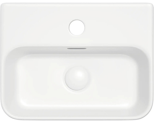 Vue de dessus d''un lavabo blanc simple avec une bonde ronde