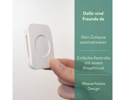 Bouton blanc pour domotique dans la main