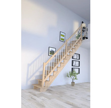 Escalier en bois avec rampe dans une pièce lumineuse.