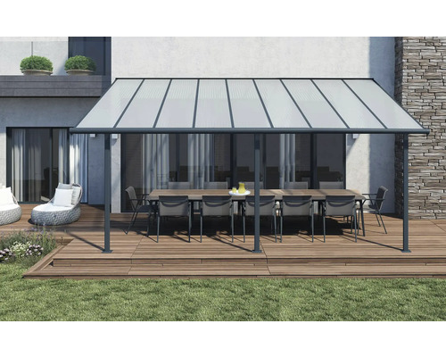 Pergola de terrasse avec table et chaises sur une terrasse en bois