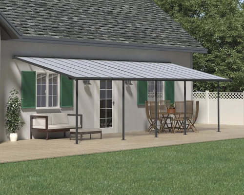 Toit de terrasse en aluminium sur une maison avec mobilier de jardin.