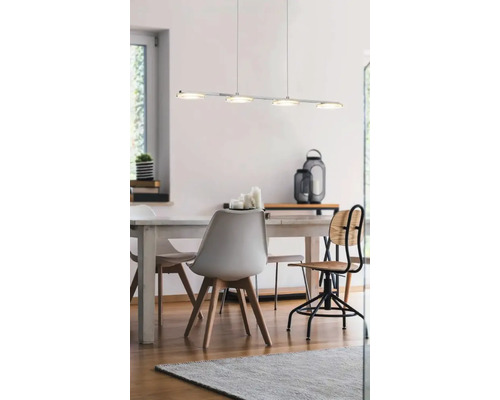 Salle à manger avec table, chaises et un luminaire suspendu moderne avec plusieurs lampes